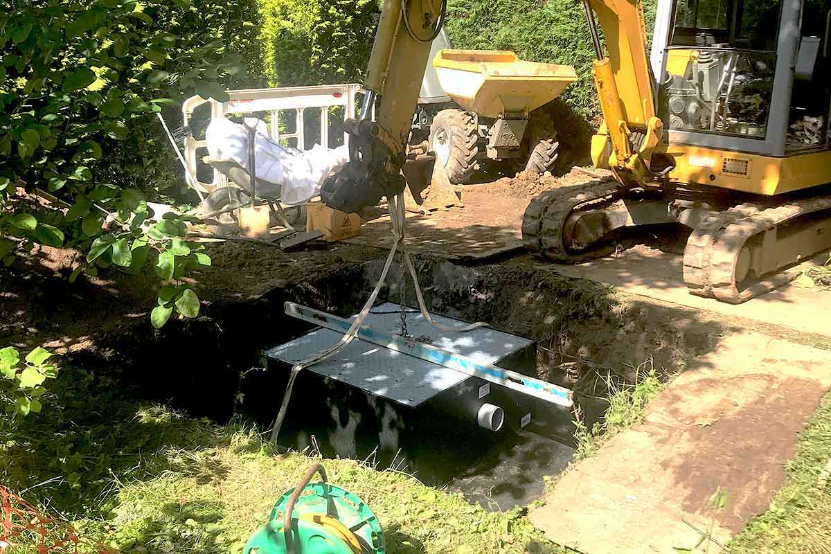 Positioning a Matrix sewage treatment plant at a property in Cranleigh Surrey