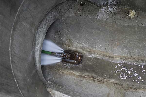 Jet wash cleaning of rainwater drains