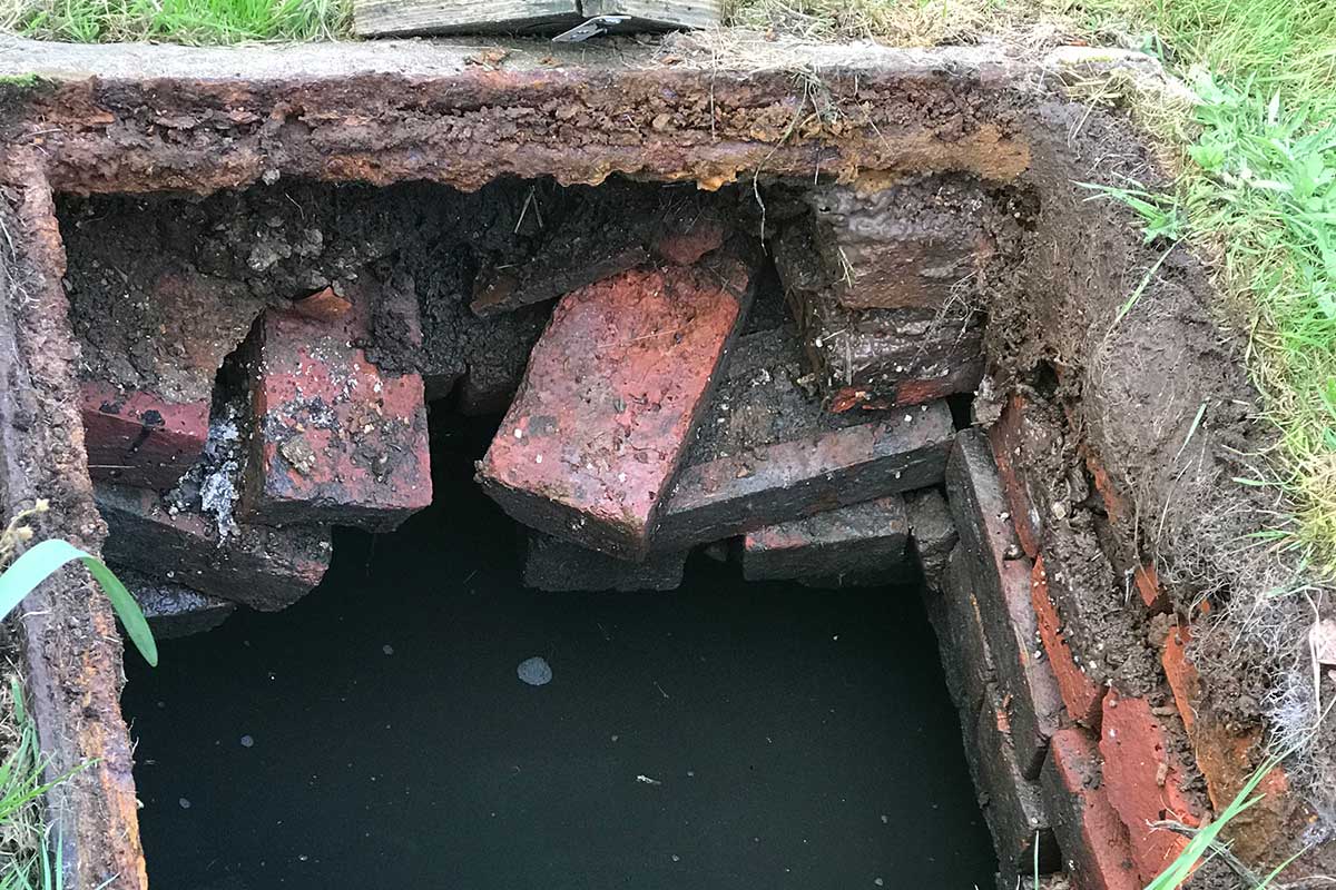 Collapsing brick built septic tank