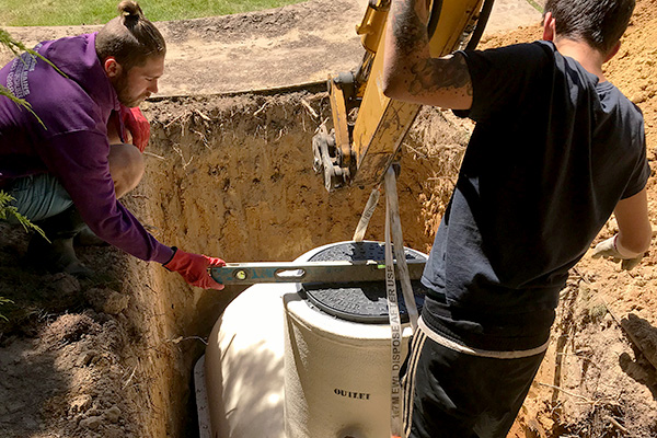 CESS engineers installing a rainwater harvesting system at a house in West Sussex