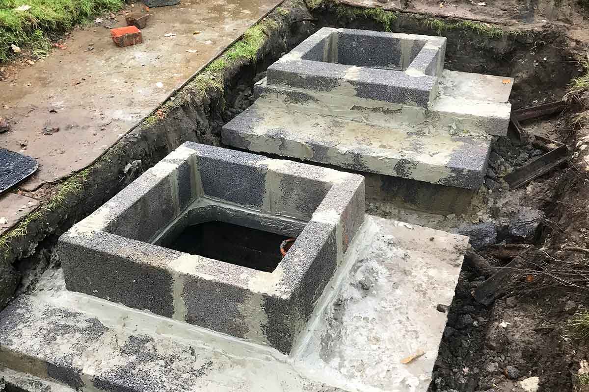 New caps and manholde covers constructed by CESS after a septic tank failure